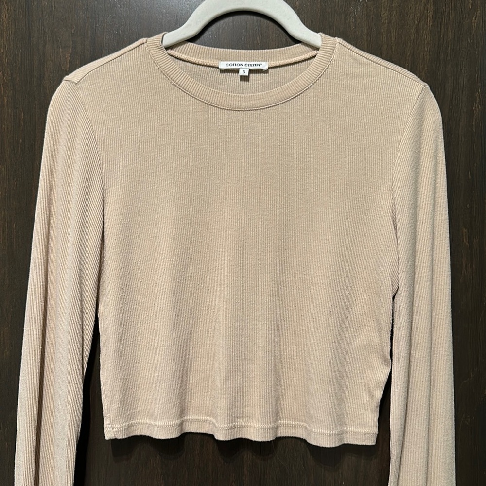 Cotton Citizen Venice long sleeve cropped tee in light beige.